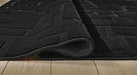 Gibbswell Washable 5' x 7' Area Rug - Venta Furnishings (San Antonio,TX)