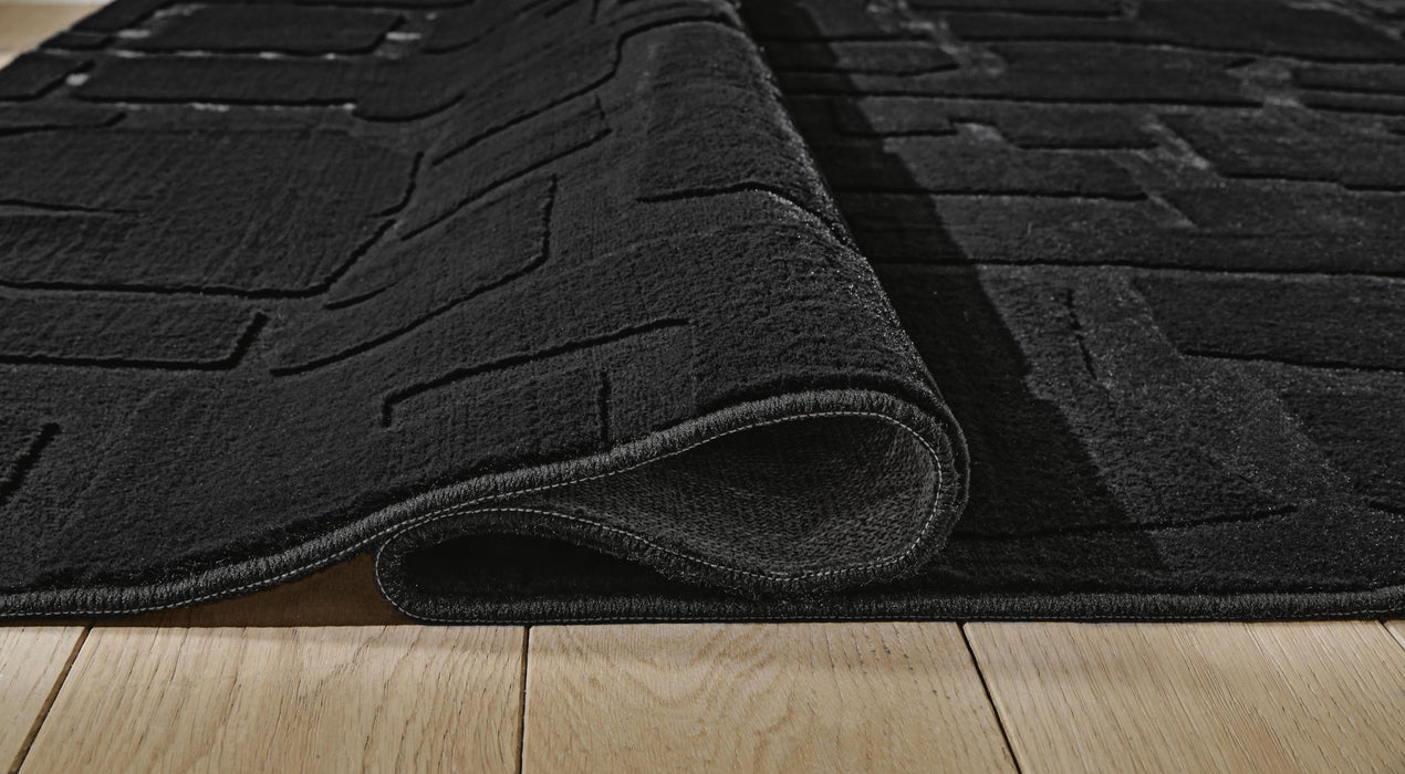 Gibbswell Washable 8' x 10' Area Rug - Venta Furnishings (San Antonio,TX)